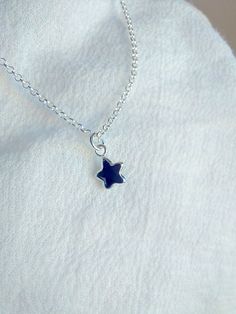 "Dainty and simple blue sapphire star necklace. Please choose your favorite necklace length at checkout. All lengths have a one inch extender, that way you'll have some wiggle room to play with the length. For example, if you choose a 14 inches necklace length, you'll have options to close the necklace at any length between 14 inches and 15 inches. Some of this charms are sold by themselves (no chain). If that option is available for this, you will have the option to buy \"CHARM ONLY\" before ad Blue Star Necklace, Dainty Jewelry Aesthetic, Blue Jewerly, Silver Sapphire Necklace, Simple Silver Necklace, Star Locket, Star Necklaces, Simple Necklaces, Necklaces Ideas