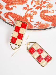 Checker earrings are the ultimate statement jewelry, and the red and white color combo kicks it up a notch. These bold, beaded earrings are just the thing to brighten your day! Brass and seed beads 2" length Made fair trade in India by one of our longstanding production partners Red Woven Jewelry For Summer, Woven Red Jewelry For Summer, Red Bohemian Rectangular Earrings, Bohemian Red Rectangular Earrings, Red Beaded Earrings As Summer Gifts, Adjustable Red Handwoven Earrings, Red Earrings With Colorful Beads For Summer, Handmade Red Beaded Earrings For Summer, Summer Red Earrings With Colorful Beads