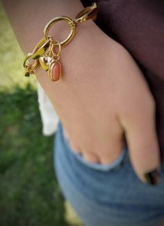 This sterling  silver and gold plated coral bracelet is handmade and unique. Because of this, there may be small difference in each piece. I used  sterling silver (925K)  with silver smithing technique and I made gold plated. This charming bracelet can be a great alternative for yourself or a gift idea in the summer time. Silver heart and coral gemstone are attached to the clasp. if you want you can separate it from the clasp and use it separately. This silver chain bracelet is suitable for dail Brass Bangle Chain Bracelet For Gifts, Brass Bangle Chain Bracelet Gift, Unique Gold Jewelry With Heart Charm, Brass Bracelet With Charms, Brass Charm Bracelet Jewelry, Metal Bracelet With Heart Charm As Gift, Handmade Gold Charm Bracelet, Unique Handmade Gold Charm Bracelet, Dainty Brass Bracelet For Gift