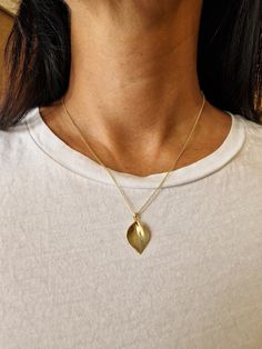 "For timely holiday delivery please choose expedited shipping in checkout. Happy holidays! Petal necklace - this unique gold leaf pendant necklace is delicate and beautiful. This botanical boho necklace is a perfect nature-inspired jewelry gift for a nature lover. This gold leaf necklace is inspired by petals and leaves. It has a delicate texture and a three-dimensional structure to achieve the look of a real leaf. This delicate leaf charm necklace will mix wonderfully with every outfit you choo Bohemian Yellow Gold Necklaces For Everyday, Bohemian Yellow Gold Necklace For Everyday Wear, Bohemian Yellow Gold Necklace For Everyday, Bohemian Yellow Gold Everyday Necklace, Nature-inspired Gold Necklace With Flower Pendant, Gold Nature-inspired Necklace With Flower Pendant, Leaf-shaped Yellow Gold Necklace For Gift, Leaf-shaped Yellow Gold Necklace, Delicate Gold Leaf-shaped Jewelry