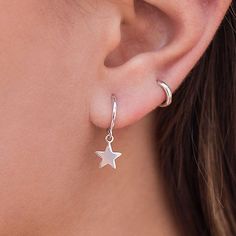 These Earrings are Sterling Silver Hoops with a hanging star. They are earrings that feel great for day to day or for a special occasion. They are modern and minimalist in style and you can wear them both on the earlobe and on the cartilage. You can buy the earrings in sterling silver or silver with a gold plating. Features: 925 sterling silver silver or gold plated Diameter: 11mm nickel free. If you have any questions, do not hesitate to contact us, we will be happy to assist you! Hanging Star Earrings, Silver Hoops Earrings, Small Silver Hoop Earrings, Dagger Earrings, Silver Star Earrings, Gothic Earrings, Hoops Earrings, Girly Jewelry, Gothic Jewelry