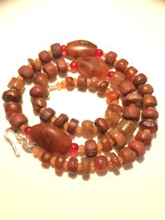 A beautiful collection of very old ancient Carnelian Beads , Carnelian Beads, . They are found in Afghanistan, India, Pakistan and Tibet. They can be used to make a beautiful contemporary designed necklaces. Each bead is authentic and old. Highly collectible 9 pictures are there you can swipe each to see all pictures silver lock 95.5with the necklace Brown Carnelian Beaded Jewelry, Brown Gemstone Beaded Necklace With Round Beads, Brown Gemstone Beaded Necklaces With Round Beads, Unique Brown Gemstone Beaded Necklaces, Bohemian Gemstone Beads And Cabochons In Brown, Artisan Carnelian Beaded Necklaces, Carnelian Natural Stone Beads For Gifts, Artisan Carnelian Beads For Gifts, Handmade Carnelian Beads For Jewelry Making