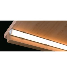 a light that is on the side of a wooden structure with wood grained surface