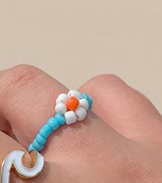 beaded daisy rings available in white and blue fits up to sizes 7-10 Daisy Rings, Beaded Daisy, Friendship Bracelets Patterns, Diy Friendship Bracelets, Diy Friendship Bracelets Patterns, Daisy Ring, Bracelets Patterns, Butterfly Ring, Midi Rings