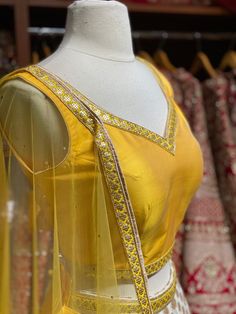 Daisy white brocade print skirt with golden border paired with contrasting yellow plain blouse and net dupatta. Fabric: Georgette This outfit can be customized in multiple colors and specific to client measurements. 90 days of production time is required and are for bulk orders only! Orders are processed in store only! Final fittings/alterations not included. Minimum Order Quantity- 4 pieces Bridesmaid Lehenga, White Bridesmaid, Plain Blouse, Net Dupatta, Printed Skirts, Lehenga, Daisy, White, Fashion Tips