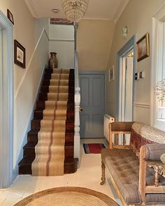 the stairs in this house are lined with rugs