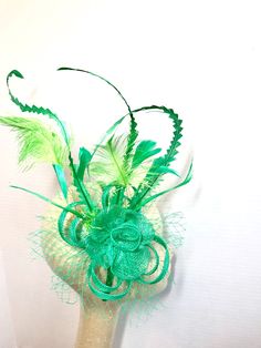 "Sinamay Fascinator with feathers attaches with hair comb. Style: The Ellie Rose ♥Attaches with hair comb which allows you to place the piece as you like. ♥Ultra Light & comfortable to wear. ♥Packed and shipped in a sturdy box with special love & care to ensure a safe delivery. ♥Includes a hat care card with instructions on how to care for & keep your piece beautiful. ♥Over 14,000 pieces sold & 2,000 5 star reviews. Our \"Hive Girls\" come back year after year for their next hat Green Feathered Mini Hat For Wedding, Green Mini Hat With Feathers For Wedding, Elegant Green Feathered Headpieces, Green Wedding Fascinator With Feathers, Elegant Green Mini Hat With Feathers, Green Feathered Fascinator For Kentucky Derby, Green Feathered Mini Hats For Races, Green Feathered Headpiece For Weddings, Summer Mini Hat With Feathers In Green