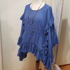 Gorgeous Blouse By Olympiah, The High-End Luxury Designer Mother-Daughter Duo From Sao Paulo, Brazil. Formed Out Of The Love Of Putting Needle To Thread, For Women Who Love Passion And Originality In Their Clothes. Size 40 Is Equal To A 6, But Would Fit A Size 8 Better. Retail Approx $254 New With Tags! Slate Blue Color (Like Actual Photos) Ruffled Sleeves Cascade Down The Sides Of The Blouse. Round Neckline, Ruched Waist, Side Ties. Measures 38" Bust, Length From Shoulder Is About 28" Bohemian Blouse With Ruffles For Brunch, Bohemian Ruffle Blouse For Brunch, Bohemian Ruffled Blouse For Brunch, Flowy Blouse With Ruffle Hem And Sleeves, Flowy Ruffle Sleeve Blouse With Ruffle Hem, Elegant Blue Blouse With Ruffle Sleeves, Elegant Blue Tops With Ruffle Hem, Blue Bohemian Blouse With Ruffle Sleeves, Bohemian Blue Blouse With Ruffle Sleeves