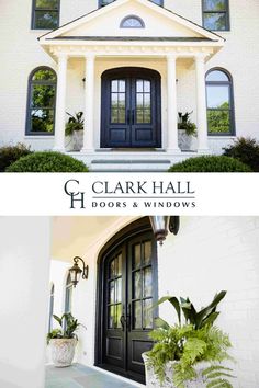 two doors and windows in front of a white house with green plants on each side