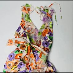 Evelia Asymmetric Floral Maxi Dress , Silky Floral Ruffled Halter Dress Alice + Olivia Silky Floral Maxi Dress. Silk/Viscose Sheer Overlay With A White Stretch Lining. Halter Ties And A Plunge V-Neck. Beautiful Bright Orange, Purple And Green Colors. The Perfect Sprint Piece. Nwt Comes In Size 4 And 6 Silk Vacation Dress With Tie Back, One-piece Floral Print Spring Dress, Orange Silk Maxi Dress For Summer, Orange Asymmetrical Summer Dress, Orange Tie Back Dress For Brunch, Orange Beachwear Dresses For Brunch, Summer Asymmetrical Silk Maxi Dress, Orange Summer Dress With Tie Back, Asymmetrical Silk Maxi Dress For Summer