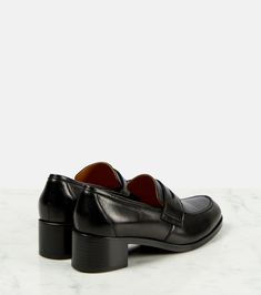 Vera leather loafer pumps in black - The Row | Mytheresa Elegant Slip-on Calf Leather Loafers, Business Casual Slip-ons With Leather Sole And Almond Toe, Luxury Leather Sole Slip-ons For Office, Business Almond Toe Slip-ons With Leather Lining, Leather Slip-ons With Almond Toe For Office, Elegant Slip-on Platform Loafers For Office, Slip-on Loafers With Branded Heel Counter, Business Casual Closed Toe Slip-ons With Leather Sole, Elegant Leather-lined Pointed Toe Slip-ons