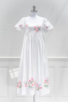 An eye catching summer dress, the Florentina features vibrant floral embroidered on the bodice and hem on a white linen-blend. A smocked elastic back and gentle a-line silhouette make for a comfortable and flattering fit. Perfect for a statement vacation piece, or to simply stun while out and about this summer! .. Deta White Cotton Maxi Dress, Summer Details, French Girl Style, Embroidered Midi Dress, Empire Waistline, Grad Dresses, Mon Cheri, Maxi Dress Cotton, Puffed Sleeves