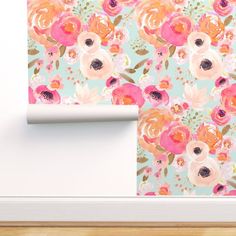 a wallpaper with pink and orange flowers on it, next to a white door