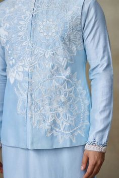 Icy blue Nehru jacket with resham, zari thread embellishment in geometric cutwork pattern. - Aza Fashions Designer Blue Nehru Jacket For Diwali, Blue Nehru Jacket With Intricate Embroidery For Diwali, Diwali Blue Nehru Jacket With Intricate Embroidery, Designer Blue Nehru Jacket With Intricate Embroidery, Blue Nehru Jacket With Intricate Embroidery For Festive Occasions, Festive Blue Nehru Jacket With Intricate Embroidery, Blue Cotton Nehru Jacket With Resham Embroidery, Blue Sherwani For Spring Festive Occasions, Blue Sherwani For Spring Festivities