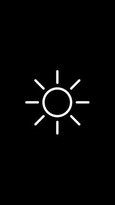 a black and white photo with the sun in it's center, on a dark background