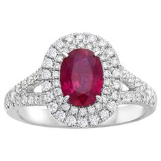 With this exquisite diamond and ruby ring, style and glamour are in the spotlight. This 18-karat diamond and ruby ring is made from 4.1 grams of gold. This ring is adorned with VS2, G color diamonds, made out of 72 diamonds totaling 0.58 carats, and 1 oval-shaped ruby totaling 1.14 carats. It comes in a size 6.5. Diamond Oval Ring, Diamond And Ruby Ring, Oval Diamond Ring, Oval Ring, Oval Rings, Ruby Diamond, Ring Style, Ruby Ring, Oval Diamond