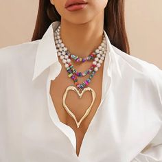 Glam Layered Necklace In Multicolor Beads And White Faux Pearls With A Large Gold Heart Pendant. Boutique Packaging Includes Storage Bag New To Poshmark? Use Code Emmiesbling For $10 Off Your Purchase When You Open A New Account. Check Out My Other Listings If You Like Boho Hippie 60’s 70’s 80’s 90’s Y2k Retro Mcm Pin-Up Beach Western Pool Coachella Festival Southwestern Bohemian Vintage Ig Instagram Tik Tok Gypsy Spell Vici Nasty Gal, Misguided, House Of Cb, Quay, Windsor, Lulus, H&M, Forever 2 Estilo Boho Chic, Heart Shaped Necklace, Multi Layer Necklace, Heart Pendant Gold, Neck Jewellery, Styl Boho, Vintage Heart, Colourful Necklace, Mua Sắm