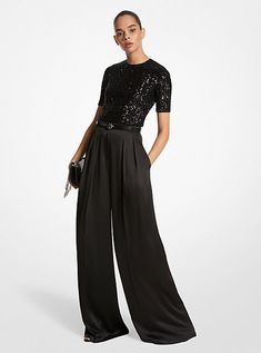 A masterclass in everyday sophistication, these palazzo pants are finely tailored in Italy from liquid-like satin and dyed in a versatile noir hue. The mid-rise silhouette features finely pressed creases that lend effortless movement with each step. Further accentuate the dramatic wide-leg cut with soaring high-heel sandals. Glamorous Luxury Pants For Date Night, Womens Cocktail Attire Pants Evening Party, Wide Leg Pants Dressy Outfit, Black Trousers Outfit Dressy, Cocktail Outfit Pants Women, Palazzo Pants Cocktail Outfit, Wide Leg Pants Outfit Party, Black Pants And Black Top Outfit, Glam Black Outfit