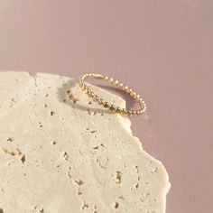 Elevate your style with our handcrafted 14k gold-filled stacking ring. Each ring is meticulously crafted, ensuring that every piece carries the artistry of handmade excellence. The result? A one-of-a-kind ring, as unique as you. This can be your everyday ring. Handcrafted in USA Sold by one ring DETAILS: Material: 14/20 Gold filled Dimensions: Width 1.4mm Note: As each piece is totally handcrafted dimensions and shapes can slightly vary ensuring no two are exactly alike. Everyday Hypoallergenic 14k Gold Stackable Rings, Dainty Stackable Midi Rings With Round Band, Dainty 14k Gold Stackable Rings, Stackable Dainty Midi Rings With Round Band, Stackable Dainty Midi Rings, Simple Gold Stackable Rings, Dainty 14k Gold Stackable Rings With Open Band, Yellow Gold Stackable Toe Rings, Dainty Hypoallergenic Open Band Jewelry