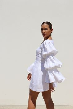 PRE-ORDER ITEM. DESIGNED IN AUSTRALIA Our signature double puff sleeve is reimagined in the perfect mini dress. Featuring an invisible zipper closure at the back and a pleat detail at the waist. The dress has a generous hem allowance, making it easy to alter for your perfect length along with exaggerated, elasticised sleeves. Made in our Exclusive IL White midweight linen which will soften with wear. SHIPPING + RETURNS: Please allow 1-3 days for delivery within Australia (depending on location) Linen Outer, African Print Maxi Skirt, African Print, Puff Sleeve, Maxi Skirt, Brand New, Mini Dress, White, Couture