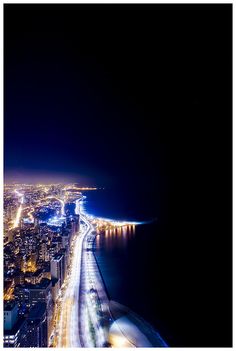 an aerial view of a city at night