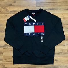 Brand New Tommy Hilfiger Sporty Black Tops, Tommy Hilfiger Black Long Sleeve Top, Tommy Hilfiger Black Tops For Fall, Black Tommy Hilfiger Tops For Fall, Tommy Hilfiger Black Crew Neck Top, Tommy Hilfiger Sweatshirt Mens, Tommy Jeans Hoodie, Vintage Tommy Hilfiger Sweatshirts, Tommy Hilfiger Crewneck