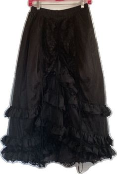 Evening Petticoat With Ruffles, Gothic Petticoat With Ruffles, Gothic Ruffled Petticoat, Gothic Petticoat With Attached Cancan, Black Long Ruffled Skirt Petticoat, Black Long Ruffled Petticoat, Elegant Black Ruffled Petticoat, Elegant Black Tiered Petticoat, Gothic Ruffled Bottoms For Halloween