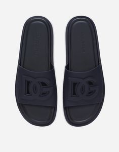 Rubber beachwear sliders with cut-out DG logo: Blue Rubber insole with debossed logo Branded rubber sole and extra-light bottom assembly Item comes with a branded dust bag Made in Italy Luxury Blue Open Toe Slides, Designer Blue Slides With Branded Insole, Functional Slip-on Slides For Streetwear, Blue Slip-on Slides For Streetwear, Blue Non-slip Synthetic Slides, Men Slides, Rubber Sandals, Dolce And Gabbana Man, Slides Shoes