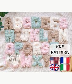 crocheted alphabet letters and numbers are displayed on a blanket with the flag of united kingdom