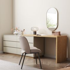 a white chair sitting in front of a desk with a mirror on top of it