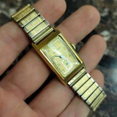 Get ready to be stunned! This is a simply stunning Vintage Art Deco Style 14k Buren Grand Prix automatic 17 jewels unisex adult wristwatch w/ a Swiss unadjusted movement, silver inlay on the watch face, solid 14k yellow-gold case & gold toned Speidel metal bracelet band. Watch is working, and keeps time pretty well, although not perfectly! The watch will need to be cleaned & serviced after purchase to ensure it is restored to it's former glory. The case has been verified as solid 14k, and the mo Metal Bracelet, Vintage Band, Gold Case, Metal Bracelets, Deco Style, Vintage Art Deco, Grand Prix, Art Deco Fashion, Aesthetic Clothes