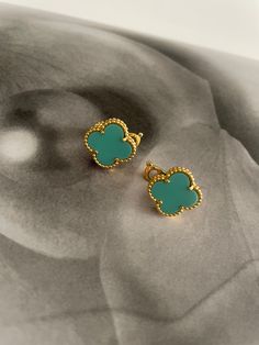 The Clover Earrings bring a classic touch of style to any look. Show off your beautiful earrings with their timeless clover design for an instantly chic style. Chic Green Earrings For Gift, Green Hypoallergenic Flower-shaped Earrings, Hypoallergenic Green Flower-shaped Earrings, Elegant Turquoise Flower Earrings Nickel Free, Elegant Turquoise Nickel-free Flower Earrings, Chic Green Earrings, Elegant Green Flower Earrings Nickel Free, Elegant Green Nickel-free Clip-on Earrings, Classic Single Green Earring