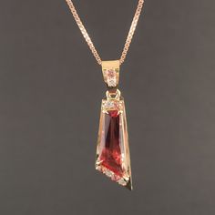 The beauty of Oregon Sunstone is etevated to new heights in this exquisite Pendant, Handcrafted with 14kt Gold, diamonds ,and sapphires, making it a truly one-of-kind-of jewelry that will be treasured for years to come. Oregon Sunstone: 2.89 ct 18 x 6.5 mm. Sapphires:0.18 ct 1.8 mm 4 qty. Diamonds: 0.11 ct 1.8 mm4 qty. Gold: 2.62 g 14 ky. Elegant Gold Gemstones With Diamond Accents, Yellow Gold Cubic Zirconia Jewelry With Accent Stones, Ruby Jewelry With Diamond Accents In Baguette Cut, Exquisite Yellow Gold Diamond Gemstones, Yellow Gold Diamond Jewelry With Gemstone Accents, Gold Cubic Zirconia Gemstones With Accents, Baguette Cut Ruby Jewelry With Diamond Accents, Formal Rose Gold Sapphire Jewelry, Fine Jewelry Gold Diamond Gemstones