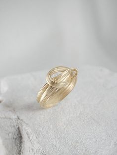 "A Perfect ring for an engagement & wedding or even as an elegant layer for an everyday ring mix. This is a truly unique piece, filled with elegance and charm and \"movement\". It is bound to become a cherished gift for your loved one. > 14K or 9K solid gold, also available in Goldplated Silver. > Can be made in yellow, white and rose 9k or 14k solid gold. Please choose a material > Ring width:approximately 4 mm > Handmade in Greece For additional sizes (also for quarter and half Adjustable Promise Ring With A Modern Twist, Modern Twist Adjustable Promise Ring, Adjustable Rings With A Modern Twist For Promise, Oval Jewelry With A Modern Twist For Weddings, Modern Twist Oval Wedding Jewelry, Stackable Fine Jewelry Bypass Ring For Wedding, Modern Twist Oval Rings For Anniversary, Modern Twist Ring Jewelry Gift, Modern Sterling Silver Bypass Ring For Wedding