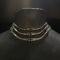 "Lead-free pewter cast chicken bone chokers. Each bone bar is 4\" x ¼\" Adjustable 14\" - 16\" See this listing for interchangeable pendant versions. https://www.etsy.com/listing/1204160736/bone-chokers-with-interchangeable?click_key=cc61314a71a59c20aee60a000413187b23f41fbe%3A1204160736&click_sum=a9392cb3&ref=shop_home_active_1&frs=1 Always ethically sourced bones. Nothing has ever been harmed for the purpose of our jewelry. All pieces are made-to-order despite the \"in stock\" number in the lis Pewter Casting Jewellery, Animal Bone Jewelry Wire, Bone Jewelry Aesthetic, Unique Metal Choker With Adjustable Chain, Nickel Free Punk Style Choker, Unique Adjustable Metal Choker, Gothic Silver Choker With Adjustable Chain, Hand Forged Metal Choker Necklace, Unique Metal Clavicle Chain Choker