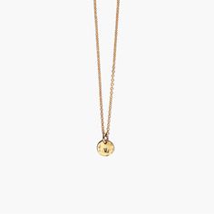 Wear our tiny initial necklace when subtlety is called for. Stamp an initial at the center of the disc and add additional pendants to spell out a name with multiple pendants. We've given the 5mm wide mini pendant a hammered finish for a rich look. Pendant hangs from our signature fine cable chain. Perfect for creating a layered look! Made of genuine 14k gold filled metal or sterling silver. | SPECIFICATIONS | Pendant size: 5mm wide. Font size: 1.6mm Metal: 14k gold filled / sterling silver. | Ca Tiny Pendant Necklace, Arrow Jewelry, Tiny Pendant, Necklace Initial, Initial Pendant Necklace, Personalized Initials, Initial Pendant, Necklace Personalized, Delicate Necklace