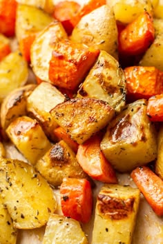 roasted potatoes and carrots with seasoning on top