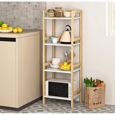 a kitchen with an oven, microwave and fruit on the shelf next to the counter