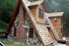 a small house made out of rocks and wood