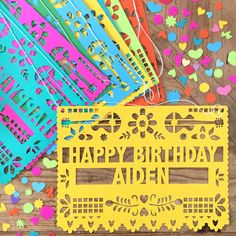 happy birthday aden card surrounded by colorful confetti and paper cutouts