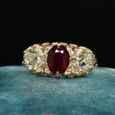 Beautiful Antique Victorian English 18K Gold Burma Ruby Diamond Three Stone Ring - GIA . This gorgeous antique Victorian English ruby and diamond ring is crafted in 18k yellow gold. The ring features a natural Burmese ruby that is unheated in the center and comes with a Lotus Gem report. The sides are gorgeous old European cut diamonds that come with a GIA report. The ring has small rose cuts in between the diamond and ruby and is in great condition. Item #R1994 Metal: 18K Yellow Gold Weight: 3.4 Grams  Size: 8 1/2 Ruby: 1.07 ct - Burma / NO HEAT -  Lotus # 5564-1786  Side Diamond: .82 ct - GIA # 2231197271 Color: S - T Clarity: VS2 Side Diamond: .77 ct - GIA # 2231197275 Color: S - T Clarity: SI2 Measurements: Top of the ring measures 9.33 mm wide and band measures 2.84 mm wide. Measureme Luxury Ruby Diamond Ring With Rose Cut Diamonds, Antique Yellow Gold Rings With Rose Cut Diamonds, Victorian Yellow Gold Cluster Ring With Diamond Cut, Victorian Cluster Ring In Yellow Gold With Diamond Cut, Antique Yellow Gold Wedding Ring With Rose Cut Diamonds, Victorian Yellow Gold Rings With Brilliant Cut, Victorian Ruby Ring With Diamond, Antique Ruby Ring With Single Cut Diamonds, Heirloom Style Oval Diamond Ring With 17 Jewels