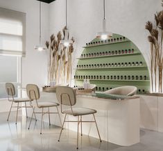 a room with several chairs and a counter in front of the wall that has bottles on it