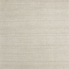 a white rug with small circles on it