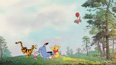 winnie the pooh and friends flying through the air in front of trees with balloons