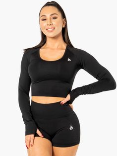 Seamless Long Sleeve Activewear For Gym, Medium Support Activewear With Thumbholes For Training, Functional Long Sleeve Moisture-wicking Sports Bra, Sporty Seamless Long Sleeve Activewear, Functional Long Sleeve High Stretch Sports Bra, Snug Fit Elastane Activewear For Training, Long Sleeve Seamless Athleisure Activewear, Long Sleeve Seamless Activewear For Workout, Black Compressive Seamless Activewear