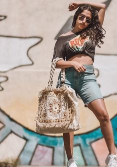 The perfect boho beach bag is here! This beautiful, one-of-a-kind tote bag features unique seashell and beaded details, a bohemian fringe border, and twisted rope handles. Take this beautiful tote bag to the beach, or use it as a fashionable carry-on on your next adventure. FINAL SALE Twisted rope handles Seashell details Beaded details Style: DR-3468 Dimensions: 22" x 17" Seashell Beach, Beach Tote Bag, California Beach, Destin Beach, Rope Handles, Style Mistakes, Beach Tote Bags, Boho Beach, Beach Tote