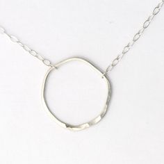 Elegant Full Circle Hammered Jewelry, Elegant Circle Hammered Necklaces, Elegant Hammered Circle Necklace, Sterling Silver Jewelry With Delicate Chain And Oval Pendant, Hammered Sterling Silver Round Pendant Jewelry, Hammered Sterling Silver Round Pendant, Elegant Hammered Open Circle Jewelry, Modern Hammered Sterling Silver Necklace, Silver Full Circle Jewelry With Adjustable Chain