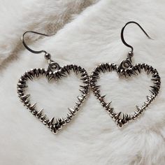 Gothic Spiked Heart Earrings. These Charms Are Approximately 24x24mm. Comes On Stainless Steel Fish Hook Earrings. Brand New. #Heart #Spike #Gothic #Punk #Earrings Punk Heart-shaped Earrings, Punk Heart-shaped Pierced Earrings, Trendy Metal Heart Pierced Earrings, Edgy Heart-shaped Pierced Jewelry, Metal Heart Drop Earrings Pierced, Silver Heart-shaped Punk Jewelry, Metal Heart-shaped Drop Earrings, Edgy Heart Charm Jewelry For Valentine's Day, Trendy Nickel-free Metal Heart Earrings