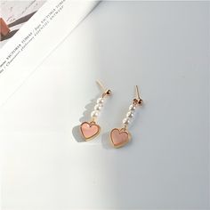 Description:Chic Pearl Heart EarringsSpecifications:Material: Eco-plated Copper, Pearl, 24k GoldSize: 3.3 cm * 1.8 cmWeight: 5 g/pair "Add a touch of elegance and love to your outfit with these Chic Pearl Heart Earrings. Perfect for any occasion, these earrings will make you stand out with their unique design. Embrace your playful side with these trendy earrings!" Real Earrings, Piercing For Women, Pink Heart Pendant, Teen Earrings, Pink Heart Earrings, Earrings Piercings, Earrings Outfit, Baublebar Earrings, Casual Earrings