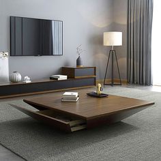 a living room with a coffee table and books